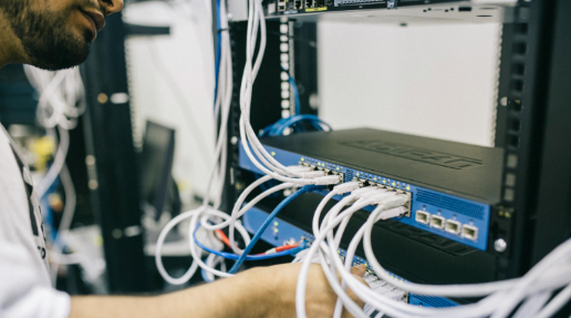 A man working on networking equipment